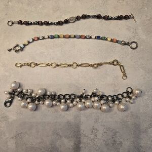 4 pretty bracelets. Great condition.